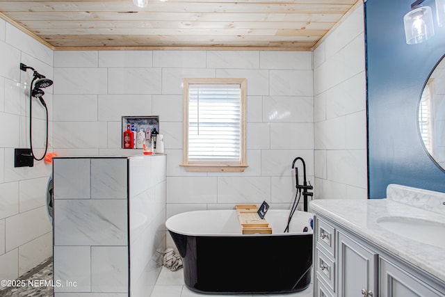 bathroom with vanity, wood ceiling, a tub, and tile walls