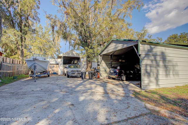 view of outbuilding with a carport