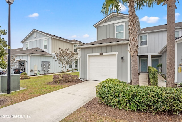 view of front facade with a garage and a front lawn