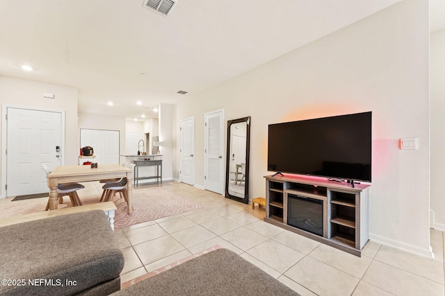 living room featuring light tile patterned flooring