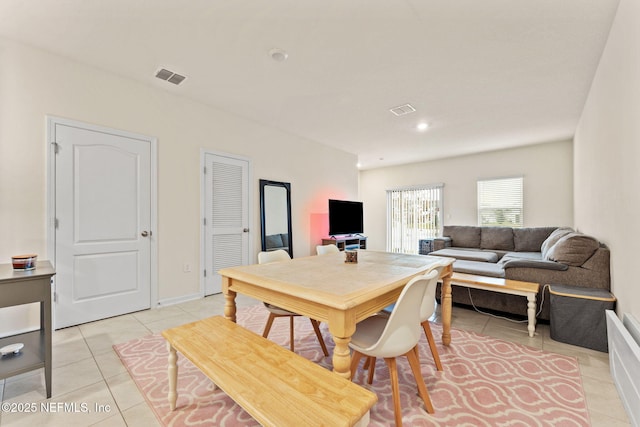 dining space with light tile patterned flooring