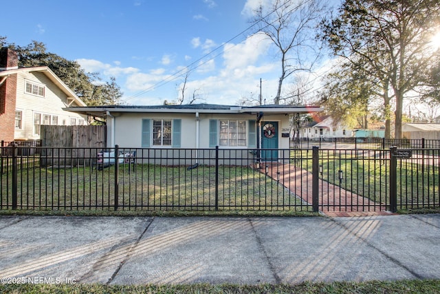 single story home with a front lawn