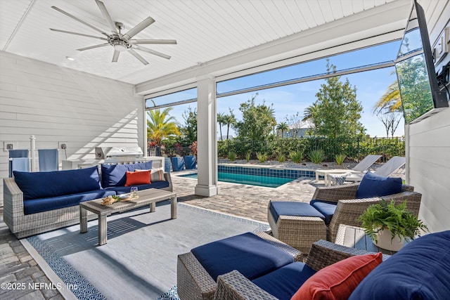 view of patio / terrace with an outdoor living space, a fenced in pool, and ceiling fan