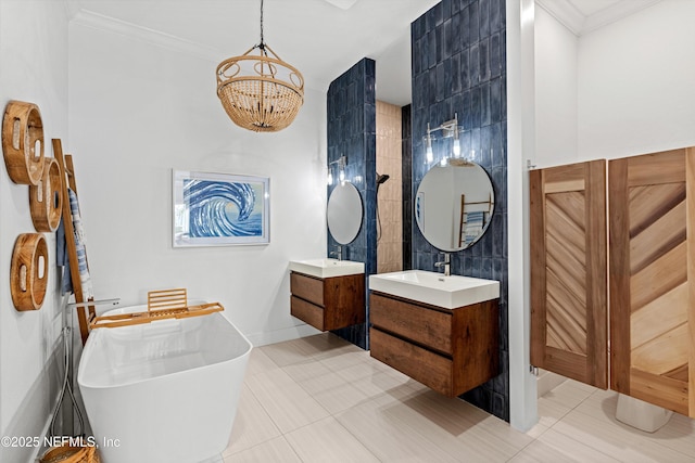 bathroom featuring tile patterned flooring, a bathtub, vanity, and ornamental molding