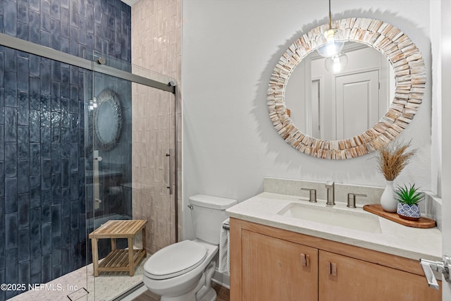 bathroom featuring toilet, walk in shower, and vanity