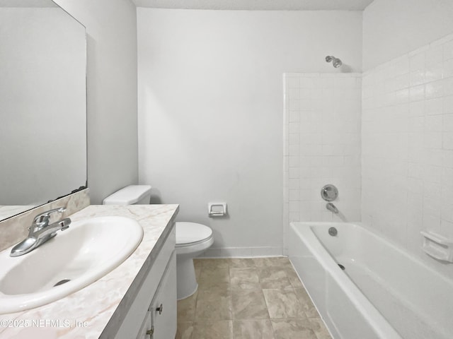 full bathroom with vanity, toilet, and tiled shower / bath