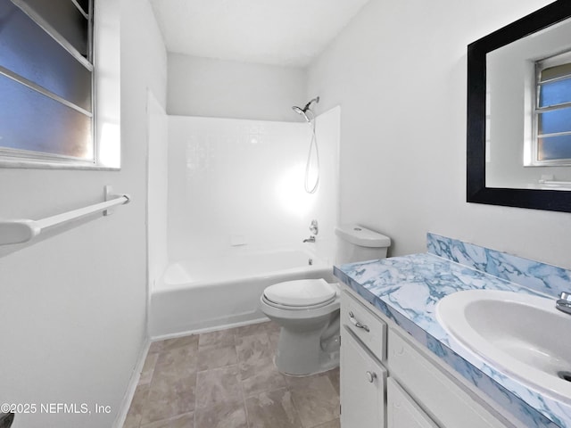 full bathroom featuring vanity, bathing tub / shower combination, and toilet