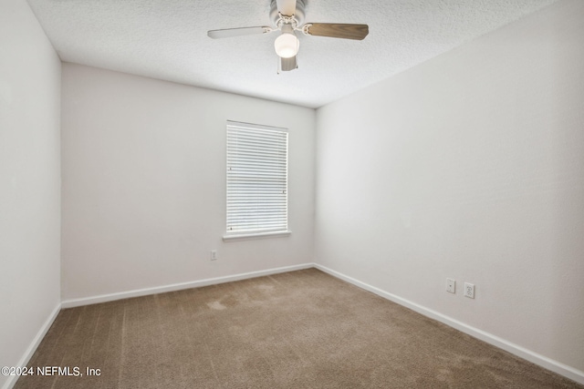 empty room with carpet flooring and ceiling fan