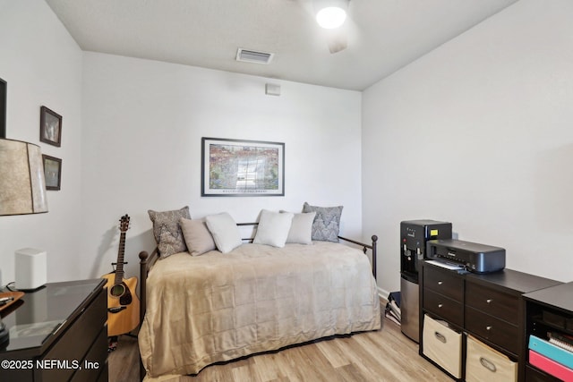 bedroom featuring light wood-type flooring and ceiling fan