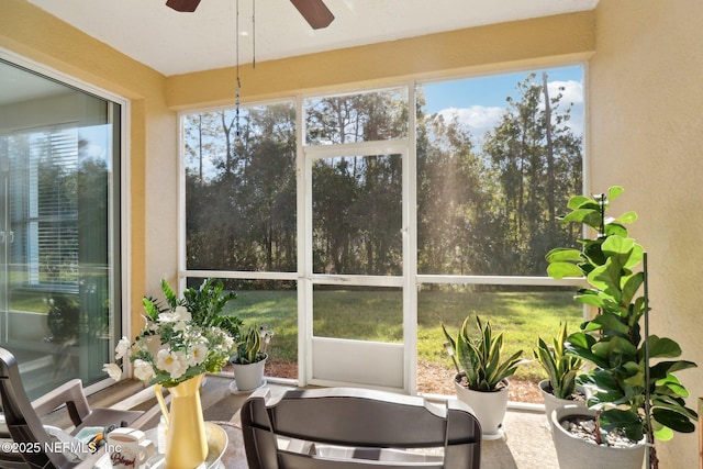 sunroom featuring ceiling fan