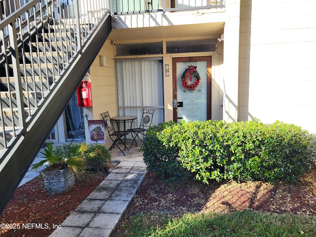 entrance to property with a balcony