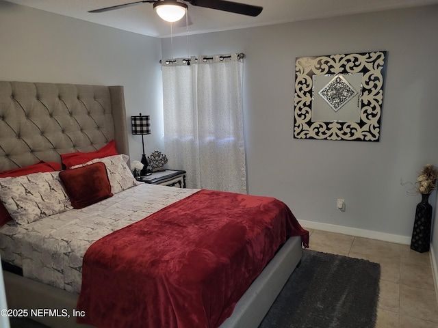 bedroom with ceiling fan and light tile patterned flooring