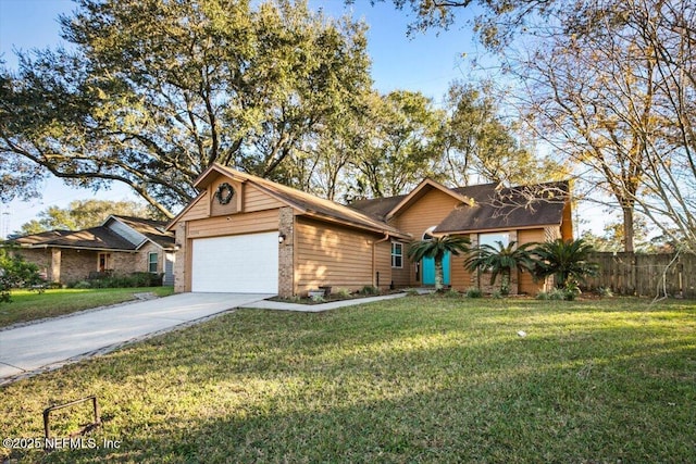 view of front of home with a front yard and a garage