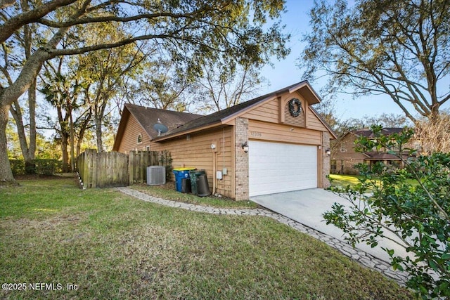 view of side of home featuring a garage, cooling unit, and a lawn