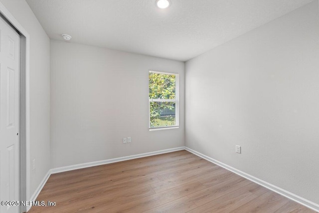 unfurnished room featuring light hardwood / wood-style flooring