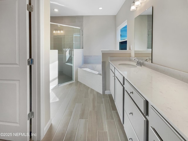 bathroom featuring vanity and plus walk in shower