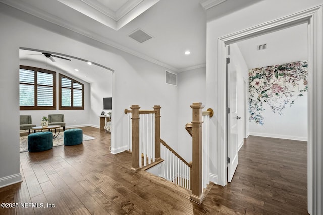 hall with dark hardwood / wood-style floors and ornamental molding