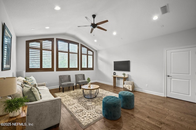 living room with dark wood-type flooring, ceiling fan, and lofted ceiling