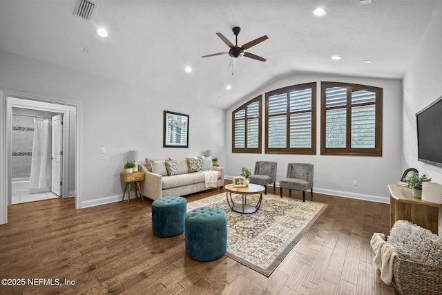 living room with dark hardwood / wood-style floors, vaulted ceiling, and ceiling fan