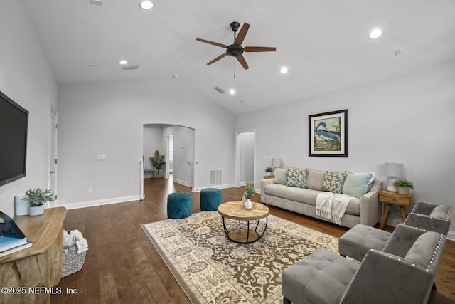 living room with dark hardwood / wood-style floors, ceiling fan, and lofted ceiling