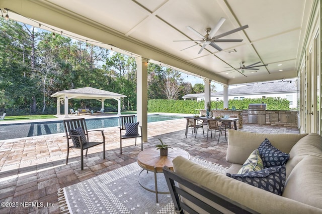 view of patio / terrace with area for grilling, outdoor lounge area, ceiling fan, a gazebo, and a grill