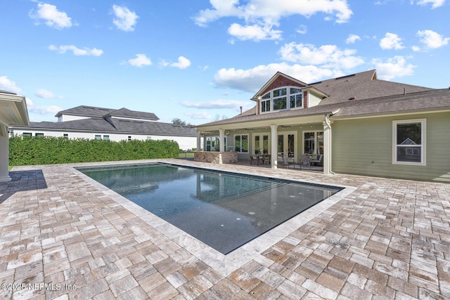 view of swimming pool featuring a patio area