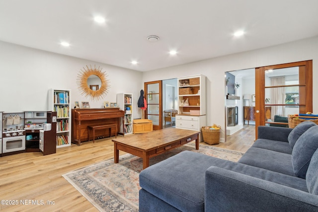 living room with light hardwood / wood-style flooring