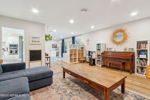 living room with light hardwood / wood-style flooring