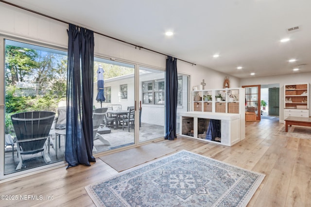 living room with light hardwood / wood-style flooring