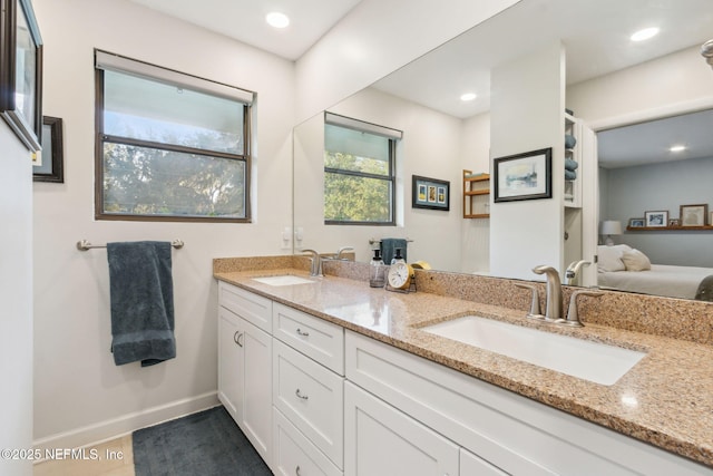 bathroom with tile patterned flooring and vanity