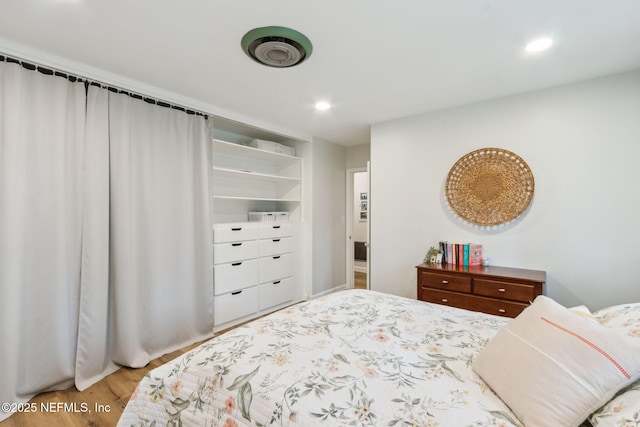 bedroom featuring hardwood / wood-style flooring