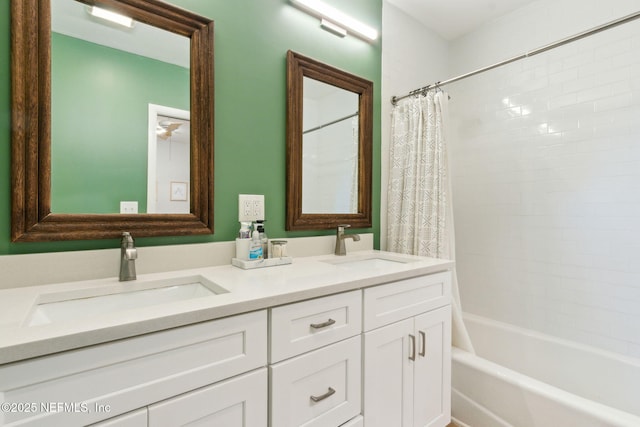 bathroom featuring vanity and shower / bath combination with curtain