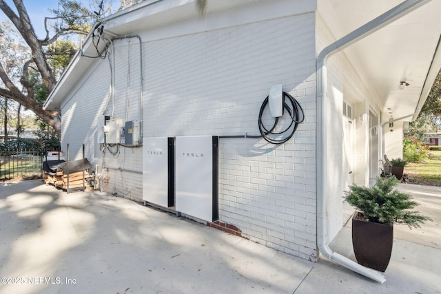 view of side of home with a patio