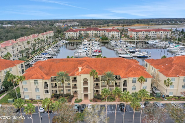 birds eye view of property featuring a water view