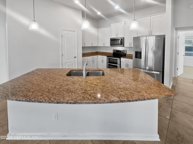 kitchen featuring white cabinets, decorative light fixtures, stainless steel appliances, and sink