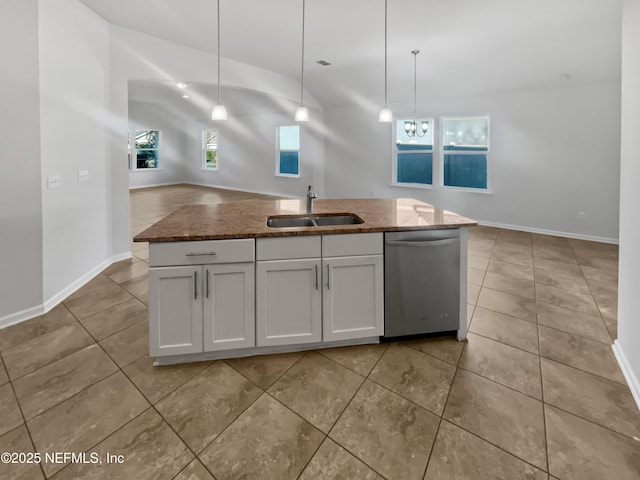 kitchen with sink, stainless steel dishwasher, decorative light fixtures, a center island with sink, and white cabinets