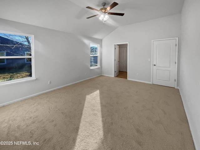 unfurnished bedroom featuring ceiling fan, light colored carpet, and lofted ceiling