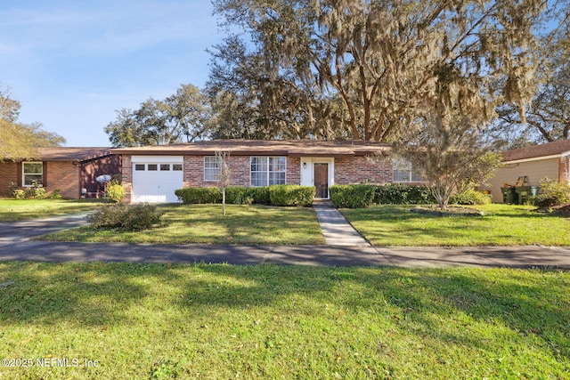 ranch-style home with a front yard and a garage