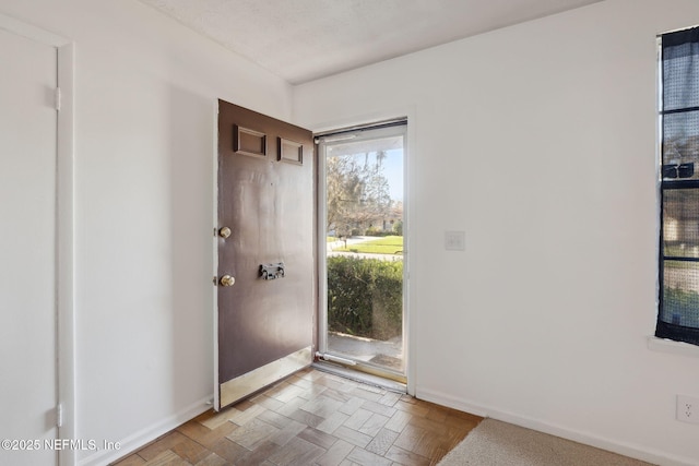 foyer entrance featuring light parquet flooring