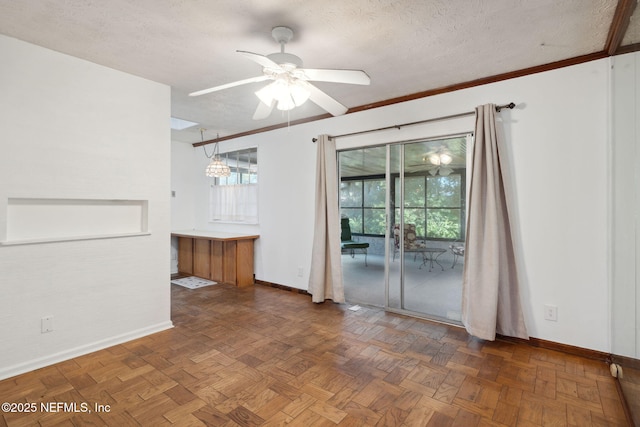 unfurnished room featuring ceiling fan, dark parquet floors, and a textured ceiling