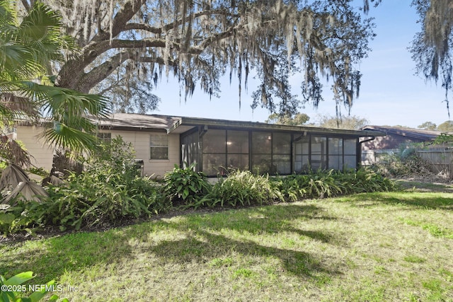 view of yard featuring a sunroom