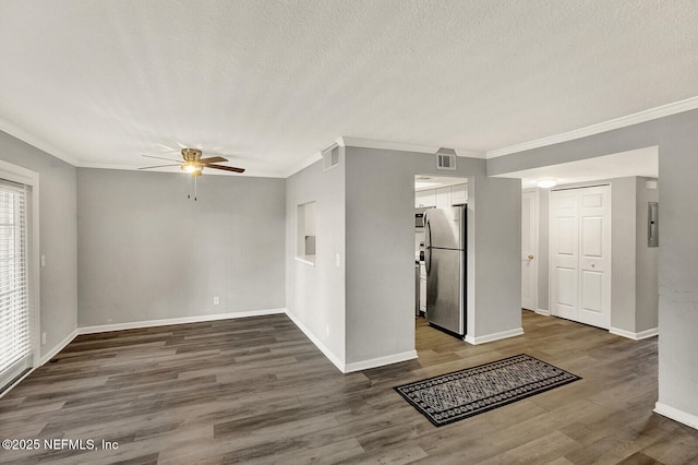 interior space with a textured ceiling, ceiling fan, dark hardwood / wood-style flooring, and crown molding