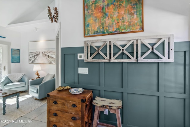 living area featuring lofted ceiling