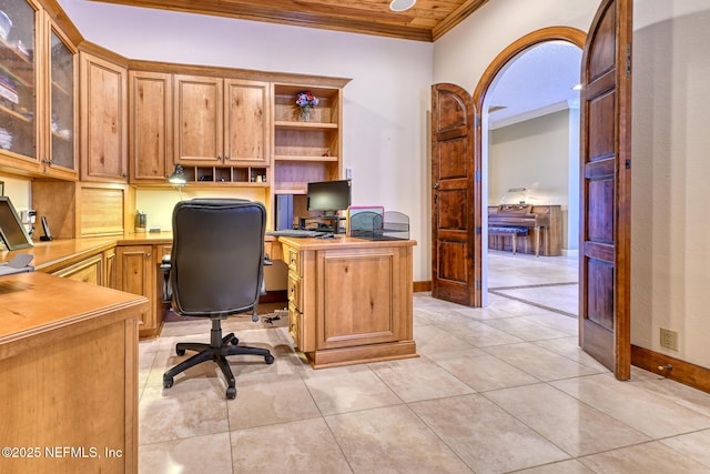 home office featuring wood ceiling, light tile patterned floors, built in desk, and crown molding