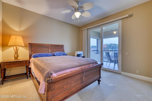 bedroom with light carpet, ceiling fan, access to exterior, and a textured ceiling