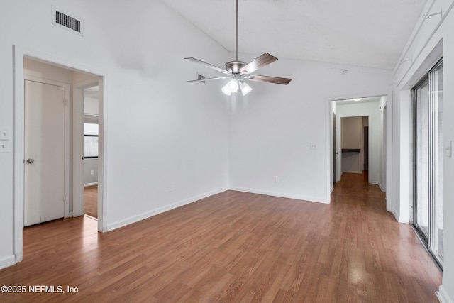 unfurnished room with wood-type flooring, ceiling fan, and vaulted ceiling