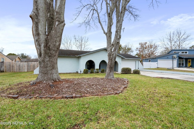 single story home featuring a front yard and a garage