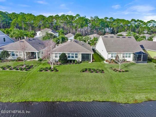 birds eye view of property featuring a water view