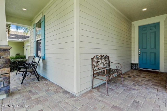 doorway to property with a porch