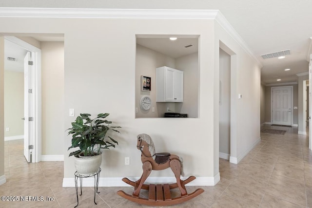 hallway featuring crown molding